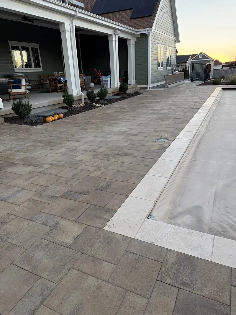 Paver pool deck at sunset